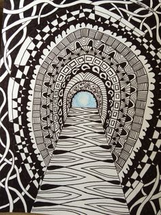 a drawing of a tunnel in the middle of a room with black and white designs on it