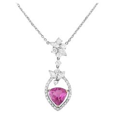 Certified Pink Sapphire and Diamond Pendant Necklace in 18k White Gold Natural Pink Sapphire and Diamond Necklace features a Purplish-Pink Modified Heart Mixed Cut Sapphire in the center of the pendant surrounded by Round and Marquise Diamonds, all set in 18k White Gold. The necklace is secured by a lobster claw clasp. The Pink Sapphire is natural and has not been heated. The Pink Sapphire weighs 2.47 carats and is GIA certified (please see copy of certificate in the photo gallery). Total diamon Luxury Pink Sapphire Necklace In Pink Gold, Pink Platinum Jewelry Gift, Gia Certified White Gold Pink Sapphire Jewelry, Pink Platinum Jewelry With Brilliant Cut, Pink Brilliant Cut Platinum Jewelry, Luxury Pink Sapphire Diamond-cut Jewelry, Luxury Pink Sapphire Jewelry With Diamond Cut, Pink Diamond Necklace For Formal Occasions, Formal Pink Diamond Necklace