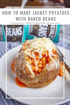 baked potatoes with baked beans and grated cheese on top, sitting on a white plate