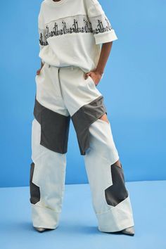 These structured pants feature layered details that define avant-garde. The relaxed fit with unique layers makes it the ultimate statement to steal the show.Black Shell: DenimOff White Shell: 100% CottonMade In IndiaDry Clean OnlyModel is wearing Size S, Height 5'9 Chic Oversized White Bottoms, Oversized White Chic Bottoms, Trendy Deconstructed Bottoms For Spring, Trendy Oversized White Bottoms, Casual Cotton Deconstructed Bottoms, Casual Wide Leg Deconstructed Bottoms, Modern White Bottoms For Streetwear, Oversized White Straight Leg Bottoms, Avant-garde Cotton Bottoms With Pockets