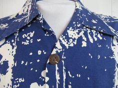 "Vintage 1960s Hawaiian shirt. Made of blue and white cotton. Shirt has a button down front, coconut buttons and a single pocket. Made in Hawaii by Tahiti Imports. Size large. Actual measurements are: 44\" at the chest 43\" at the waist 17.5\" shoulder seam to shoulder seam 29.5 overall length In very good condition." Cotton Button-up Hawaiian Shirt, Retro Blue Button-up Hawaiian Shirt, Blue Retro Hawaiian Button-up Shirt, Blue Cotton Hawaiian Shirt With Buttons, Vintage Blue Button-up Hawaiian Shirt, Retro Collared Hawaiian Shirt With Button Closure, Vintage Beach Shirt With Buttons, Vintage Buttoned Shirt For Beach, Vintage Cotton Hawaiian Shirt With Button Closure