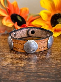 Navajo Made Leather  Sterling Silver Coin Bracelet. It measures 3/4 of an inch wide and 9 3/8 inches long.   Thank you for checking out my store, if you have any questions please contact me!!    Exported By ExportYourStore :) SKU:465806885522_7D9C* Artisan Adjustable Concho Cuff Bracelet, Artisan Adjustable Cuff Bracelet With Concho, Adjustable Southwestern Hand-tooled Bracelets, Western Concho Bracelets For Festival, Southwestern Hand-tooled Brown Bracelets, Brown Hand Tooled Western Bracelets, Western Style Concho Bracelets For Festivals, Southwestern Style Brown Concho Bracelets, Rustic Brown Bracelet With Concho