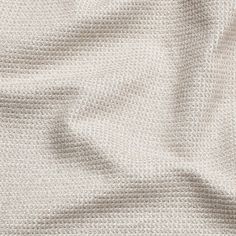 an up close shot of the texture of a white fabric