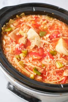 a slow cooker filled with rice and vegetables