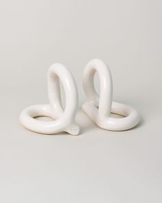 two white rings sitting on top of each other