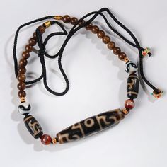 Bodhisattva Tara Dzi Bead Agilawood Necklace - BTSAN PO Traditional Brown Jewelry With Black Beads, Black Hand-strung Amulet Necklace, Traditional Hand-strung Black Mala, Traditional Black Hand-strung Mala, Traditional Black Bracelet With Wooden Beads, Traditional Black Bracelets With Wooden Beads, Black Necklaces With Wooden Beads For Healing, Black Amulet Necklace, Adjustable Black Necklace For Rituals