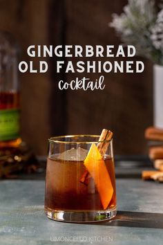 Gingerbread Old Fashioned cocktail in an old fashioned style glass. The drink is brown and has a large sphere of ice in the glass along with an orange peel and a cinnamon stick garnish. In the background to the left is a bottle of Bulleit rye whiskey, and to the right is a vase with snowy looking evergreens with a stack of wooden coasters under the vase. Text overlay above the cocktail reads “Gingerbread Old Fashioned cocktail”. Cinnamon Holiday Cocktails, Gingerbread Bourbon Cocktail, Ginger Old Fashioned Cocktail, Ginger Bread Cocktail, Gingerbread Whiskey Cocktail, Gingerbread Cocktail Holiday Drinks, Pendleton Whiskey Drinks, Gingerbread Old Fashioned, Winter Whiskey Drinks