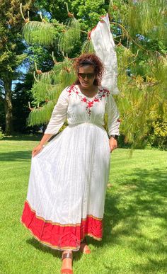 A stunning traditional hand-woven Ethiopian dress made by a female Ethiopian dress maker in sheromeda. It delivers east African vibrant colours. It is made from sustainably sourced materials and has great comfort. Folk Style Dresses With Woven Motifs For Festive Occasion, Traditional Handloom Embroidered Dress, Bohemian Dresses With Woven Motifs For Festive Season, Bohemian Festive Dress With Woven Motifs, Folk Style Festive Dresses With Woven Motifs, Festive Bohemian Dress With Woven Motifs, Bohemian Handloom Dresses For Traditional Ceremonies, Festive Bohemian Dress With Weaving Work, White Dresses For Traditional Ceremonies In Festive Season