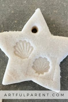 a white star with shells carved into it