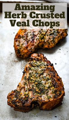 two grilled meat chops sitting on top of a pan with the words amazing herb crusted veal chops