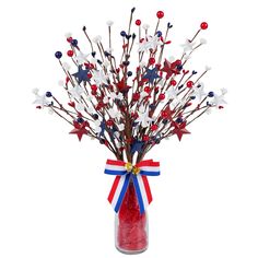 a vase filled with red, white and blue flowers