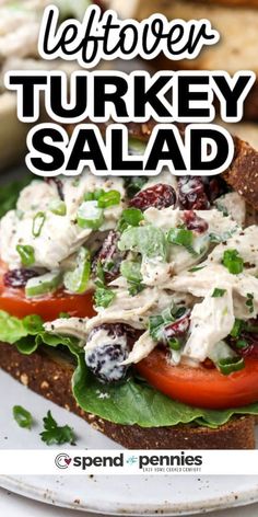 a turkey salad sandwich with lettuce and tomatoes