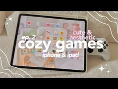 an ipad with the text cozy games on it and a video game controller next to it