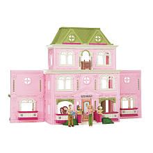 a pink doll house with people standing in the front and side windows on each floor