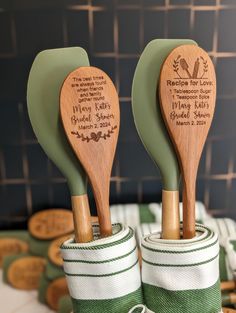 two wooden spatulas sitting on top of each other