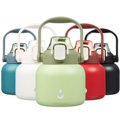 several different colored kettles with handles on them