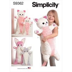 a girl holding a stuffed animal in her arms