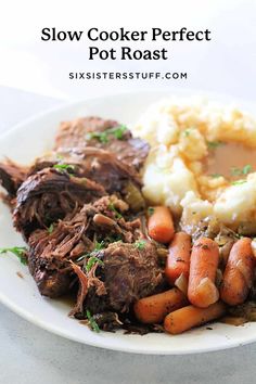 slow cooker perfect pot roast on a plate with carrots and mashed potatoes