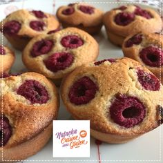 muffins with raspberries are arranged on a plate