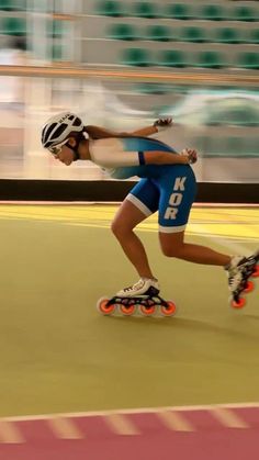 a man riding a skateboard down a track