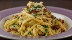 pasta with bacon and parmesan cheese on a plate