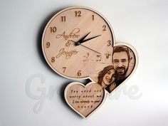 two heart shaped wooden clocks with the same photo on them