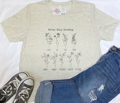 This super soft and comfy tee is sure to become one of your favorite shirts. It combines hand drawn flowers with the fruit of the spirit and reminds that we are never done growing. This shirt has a true to size unisex fit and is a freckled cream color with dark brown design. Inspirational Relaxed Fit T-shirt For Spring, The Fruit Of The Spirit, Unicorn Tee, Shirt Inspiration, Drawn Flowers, Brown Design, Faith Shirt, Fruit Of The Spirit, Hand Drawn Flowers