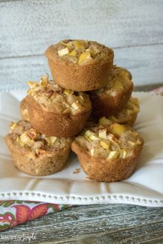 a stack of muffins sitting on top of a white plate