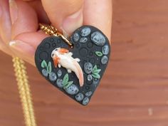 🐟 this adorable polymer clay axolotl pendant is completely hand-crafted by me. it is lightweight and comes with an 18k gold plated jump ring so it can be hung on most necklace chains.  🔗if you choose to order your pendant with a chain included (see variation) it will come with an 18-inch nickel-free iron cable chain.  💎 as with all polymer clay sculptures the pendant should not be bent or handled roughly. pendants ship in a cardboard jewelry box to avoid damage and are ready to gift!   🗨️ if you have any additional questions feel free to contact me :) Polymer Clay Axolotl, Clay Axolotl, Cardboard Jewelry, Cute Axolotl, Jewelry Polymer Clay, Clay Sculptures, Polymer Clay Sculptures, Cardboard Jewelry Boxes, Sculpture Clay