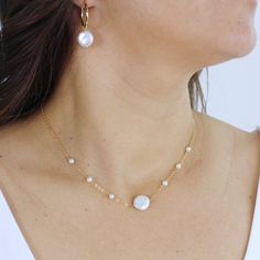 Our Sasha Freshwater Coin Pearl Necklace is a combination of elegance, femininity and effortless cool Crafted with a delicate chain and lustrous genuine coin freshwater pearl as its focal point, complemented by two small round freshwater pearls scattered on each side of the chain, is the perfect finishing touch for any bride or woman looking to add a touch of sophistication to her look. Pair it with the matching Sasha Bracelet and earrings for a coordinated and polished bridal style that's sure Coin Pearl Necklace, Single Pearl Necklace, Single Pearl, Silver Pearl Necklace, Baroque Pearl Necklace, Hair Accessories Gift, Coin Pearls, Woman Looking, Bridesmaid Wedding