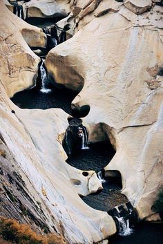 the water is running down the rocks in the canyon