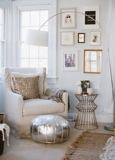 a living room filled with furniture and pictures