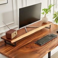 Minimalistic home office space with sleek computer monitor on wooden stand, retro radio, verdant plants, and stylish keyboard. Industrial Pipe Furniture, Whiskey Barrel Furniture, Cozy Office, Live Edge Furniture, Barrel Furniture, Pipe Furniture, Solid Wood Desk, Desk Shelf, Monitor Stand