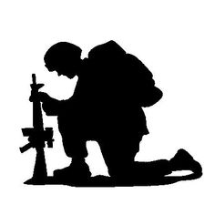 the silhouette of a man with a cross on his knee