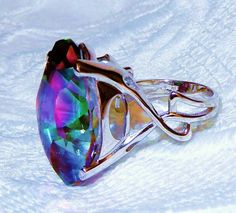 31CT NATURAL 25 X 18MM MARQUISE MYSTIC TOPAZ GEMSTONE, SETTING IS SOLID STERLING SILVER, RHODIUM DIPPED, SIZE  8 1/2 Beautiful 31ct Marquise faceted cut Mystic Topaz gemstone set in SOLID sterling silver that is dipped in Rhodium to maintain the ring's luster making the shine last. This stone was difficult to capture its beauty on film, but I won't give up.  The ring is a Size 8 1/2 and can be resized.  The ring comes in a nice ring box and an outer gift box. STONE DETAILS Stone: Topaz Color:  M Luxury Multi-stone Topaz Ring In Sterling Silver, Rainbow Topaz Ring, Pink Topaz Earrings, Gemstone Setting, Rainbow Topaz, Mystic Topaz Ring, Silver Gift Wrap, Fire Rainbow, Topaz Color