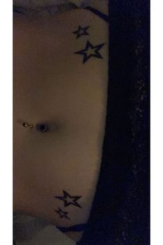 an image of a woman with stars on her stomach