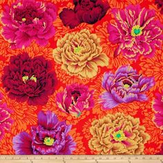 an orange and pink flower pattern with many different flowers on the same color as the background