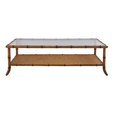 a bamboo and glass coffee table with two shelves on each side, against a white background