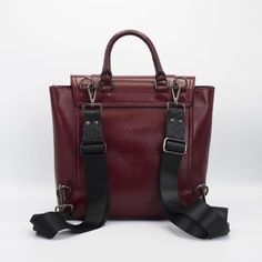 Luxury Leather Backpack With Top Handle For On-the-go, Luxury Backpack-style Satchel For Daily Use, Luxury Leather Backpack With Detachable Strap, Luxury Top Handle Backpack, Luxury Backpack With Double Handle For Daily Use, Luxury Satchel Backpack For Travel, Luxury Business Backpack Shoulder Bag, Luxury Shoulder Bag Style Backpack For Travel, Luxury Satchel Backpack With Detachable Strap