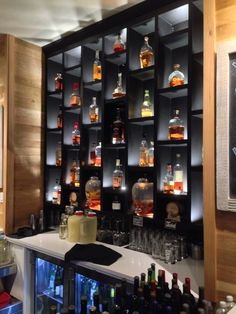 a bar with liquor bottles on the shelves