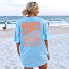 Get ready to fall in LOVE with your new Ocean Beach aesthetic beachy t-shirt. The shirt features a back print design and a hibiscus flower in the front pocket area.  It's the cutest and most comfortable way to wear the latest styles. * PRODUCT DETAILS * ✺ 100% Cotton ✺ Medium weight fabric  ✺ Wash and dry normally (on cool for best results) ✺ Designed and printed in the USA ✺ Due to different monitor screens, colors may vary ✺ * SIZING * ✺ FOR AN OVERSIZED FIT, SELECT TWO OR THREE SIZES UP FROM Beach California Aesthetic, Aesthetic Beachy, Vsco Beach, Preppy Tee, California Aesthetic, Oversized Aesthetic, Aesthetic Coastal, Orange Beach Al, Orange Beach Alabama