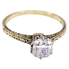 This charming engagement ring from ca 1936 features a bright white and lively cushion diamond weighing 1.1o carats, accompanied by a report from the GIA grading it G VS1. Secured by 6 eagle-claw prongs on a white ornate gallery and a hand engraved yellow gold shank. Ring size 6.75, can be sized Diamond Gold Ring, Eagle Claw, Claw Prong, Cushion Diamond, Diamond Gold, Art Deco Jewelry, Gold Diamond Rings, Gia Certified Diamonds, Jewelry Rings Engagement