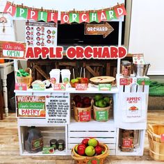 an apple orchard stand with apples and other fruit