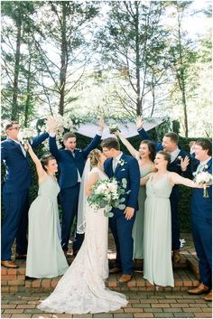 a bride and groom with their bridal party