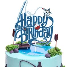 a blue birthday cake with the words happy birthday on it and an image of a fishing boat