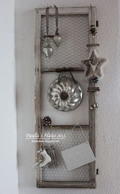 a shelf with some items hanging on it's sides and an empty card holder in the middle