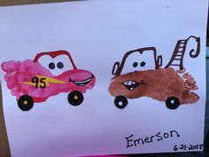 two cars painted on paper with the words emerson and eric written in front of them