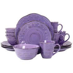 purple dishes and cups are stacked on top of each other