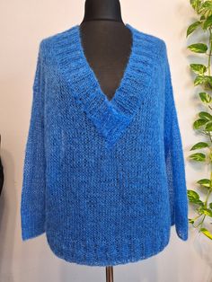 Blue color hand knitted kid mohair sweater for women. Fluffy and cozy v-neckline sweater, easy to combine with formal outfit or casual jeans. This is a stylish, long-sleeve sweater with a V-neck made from kid mohair. Measurements of size  M (sweater laying flat): - A chest width 59 cm/23.2 in; - B length to neck front 53 cm/20,9 in; - C under arm sleeve length 43 cm/16.9 in. Material: 75% merino wool, 25% polyamide. Product Details: 100% hand knit. Made in a smoke free environment. Ready to ship Pull Mohair, Summer Sweater, Iron On Fabric, Summer Sweaters, Mohair Sweater, Pullover Sweater Women, Arm Sleeve, Formal Outfit, Casual Jeans