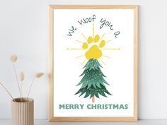 a christmas card with a pine tree and the words, we woof you merry christmas